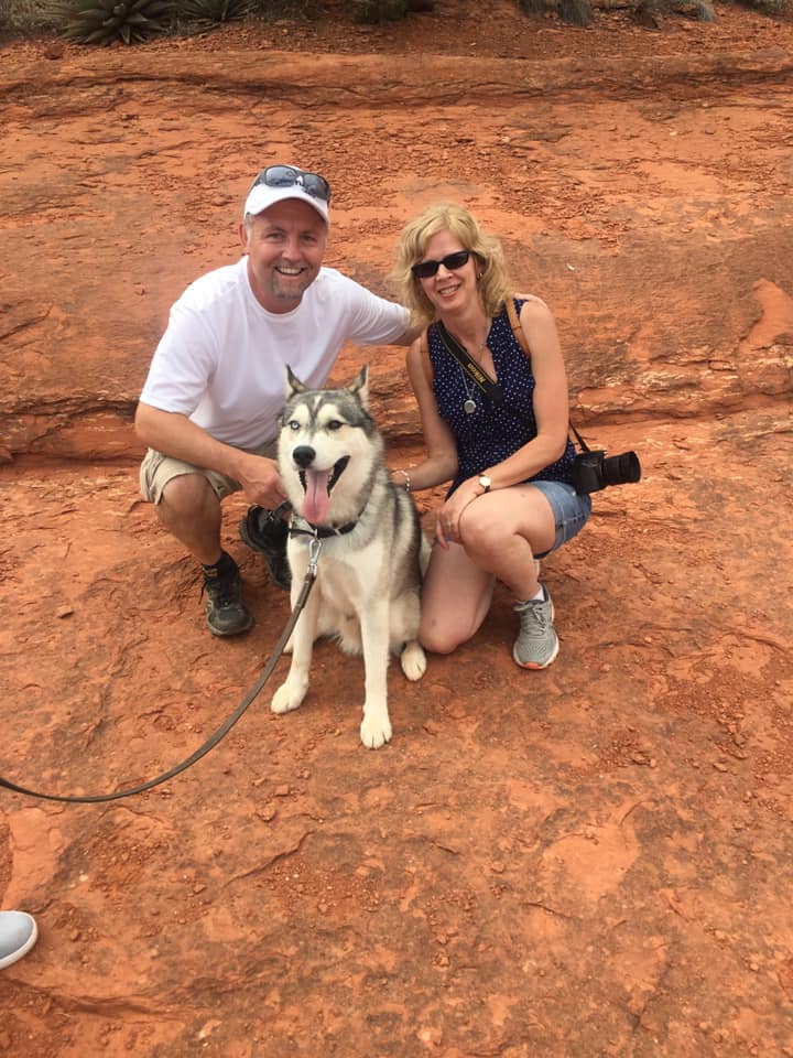 Jared and Sandy Wockenfuss outdoors with their dog
