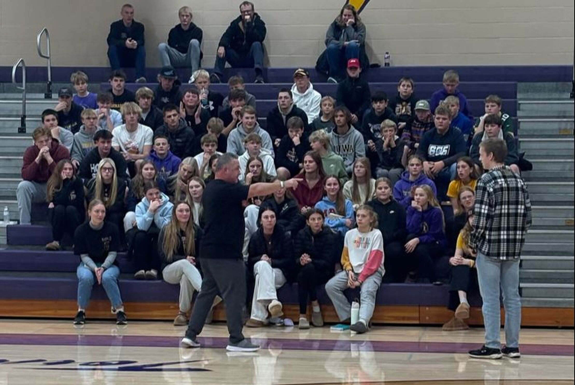 Jared Wockenfuss with a large FCA huddle in a school gym